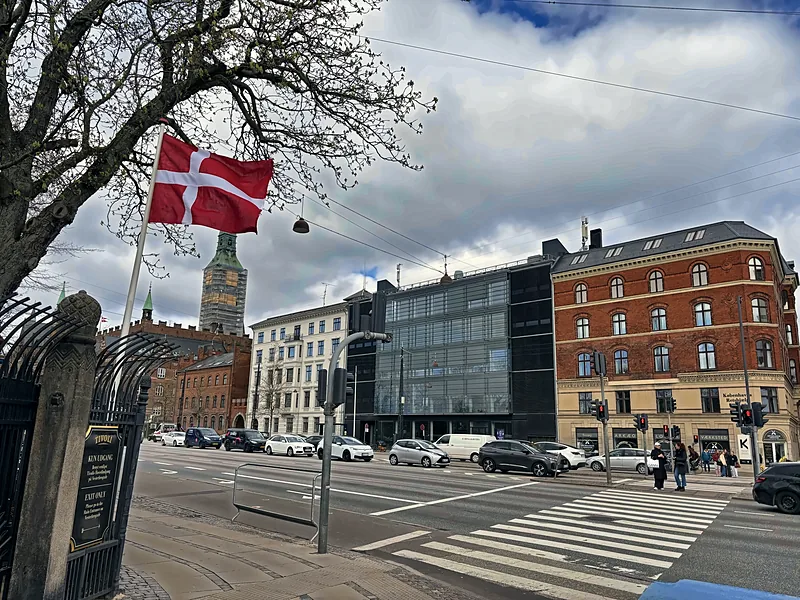 A Copenhagen street under the Danish flag