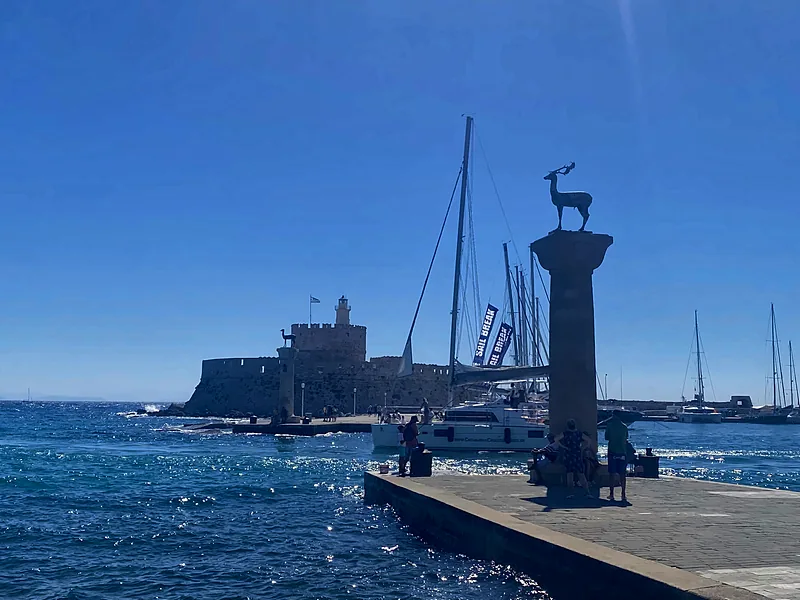 Mandraki harbour and the deer column